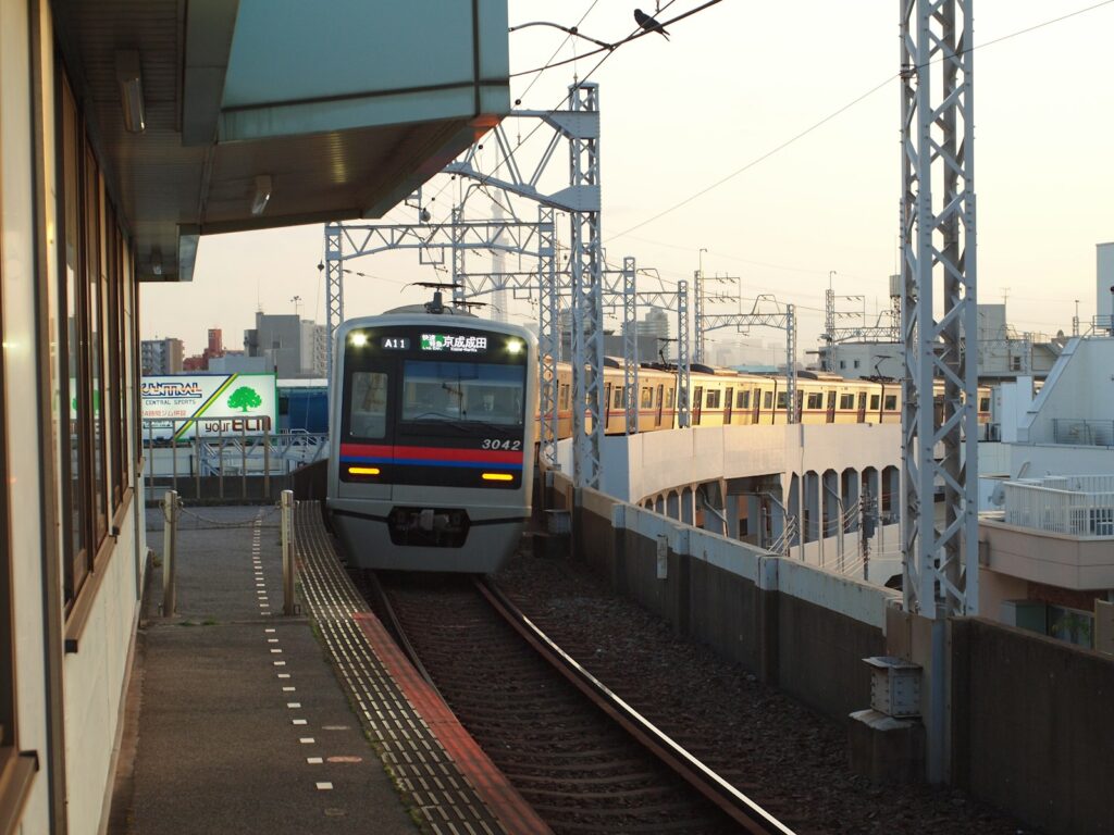 blue and yellow train on rail tracks during daytime