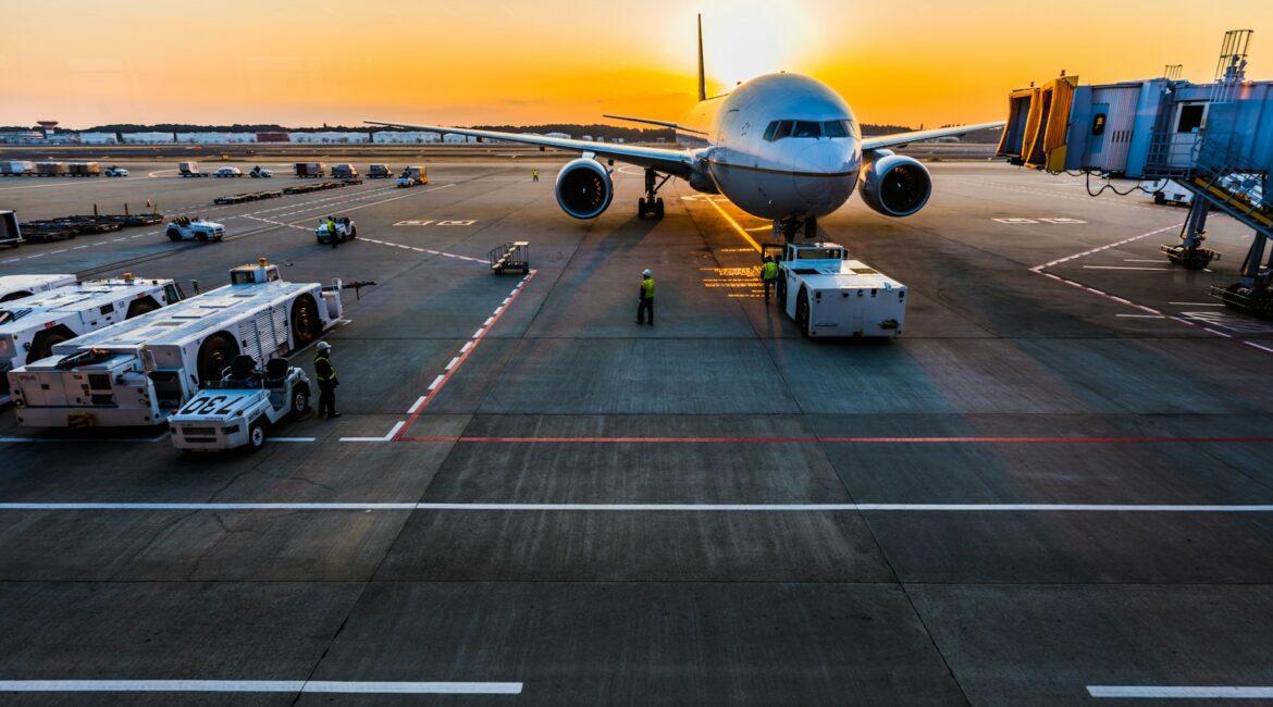 gray airplane on parking